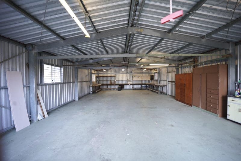 A cold garage interior of the kind a shop heater is bought for - a stand-in for the Dr. Infrared Heater DR-988A Garage Shop Heater, not a photograph of this model