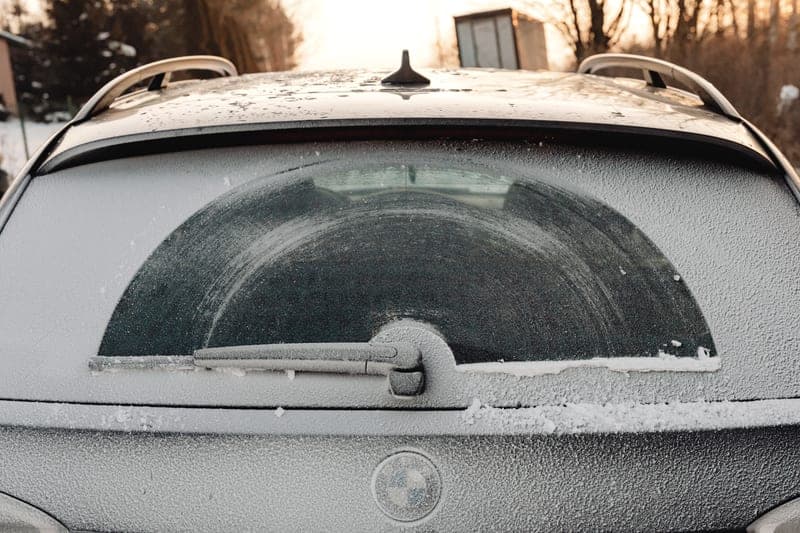 A windshield covered against overnight frost, of the type described - a stand-in for the FrostGuard Standard Windshield Cover, not a photograph of this model